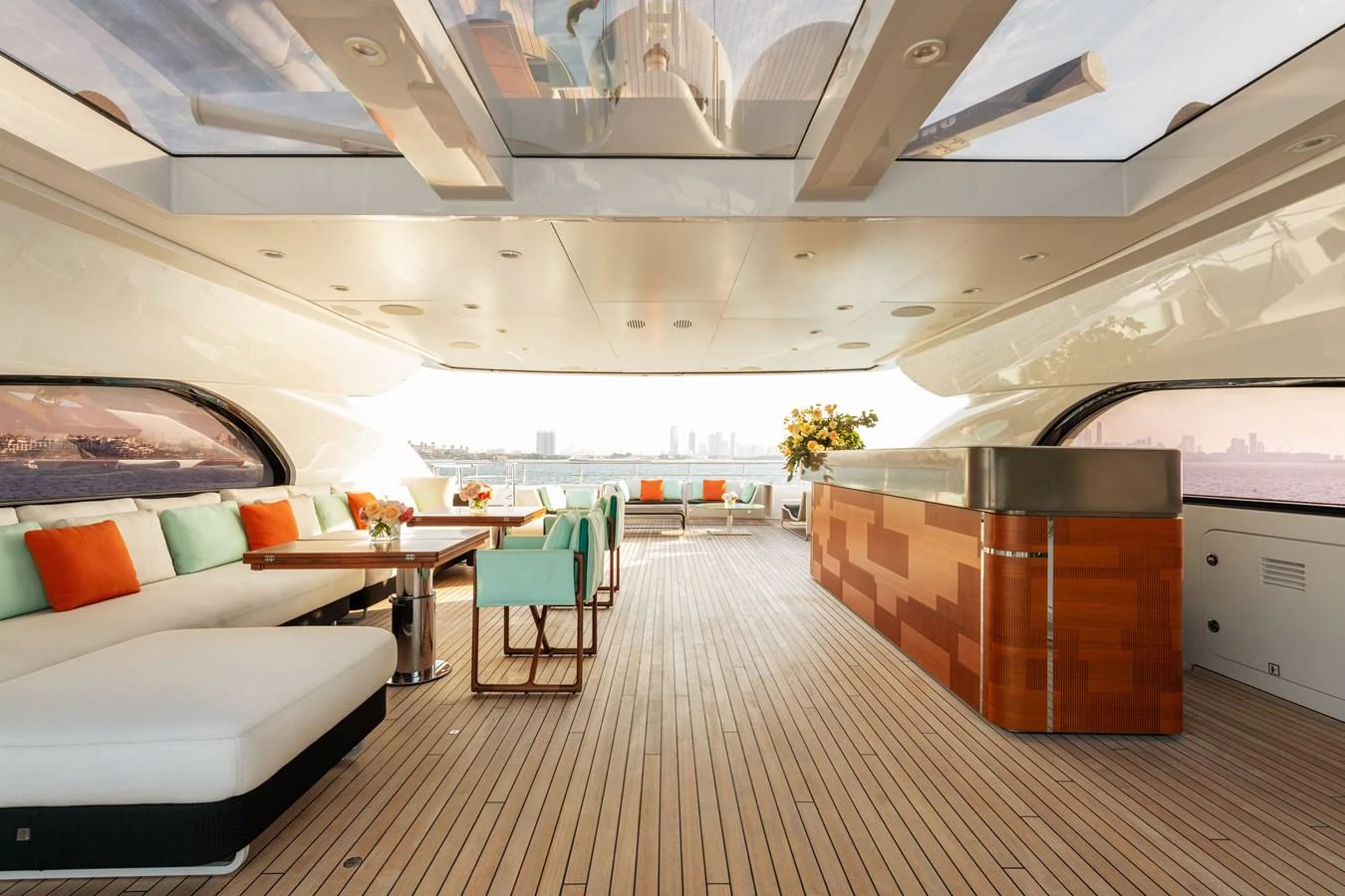 The aft deck features a spacious and elegant seating area with a bar, perfect for entertaining guests while enjoying the ocean view. aboard ROCKET Yacht for Sale