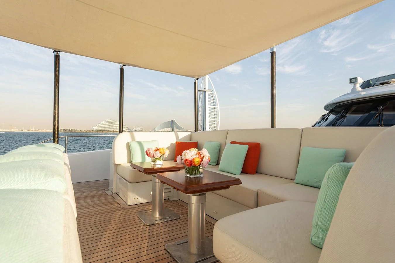 The aft deck features comfortable seating with a view of the water and skyline. aboard ROCKET Yacht for Sale