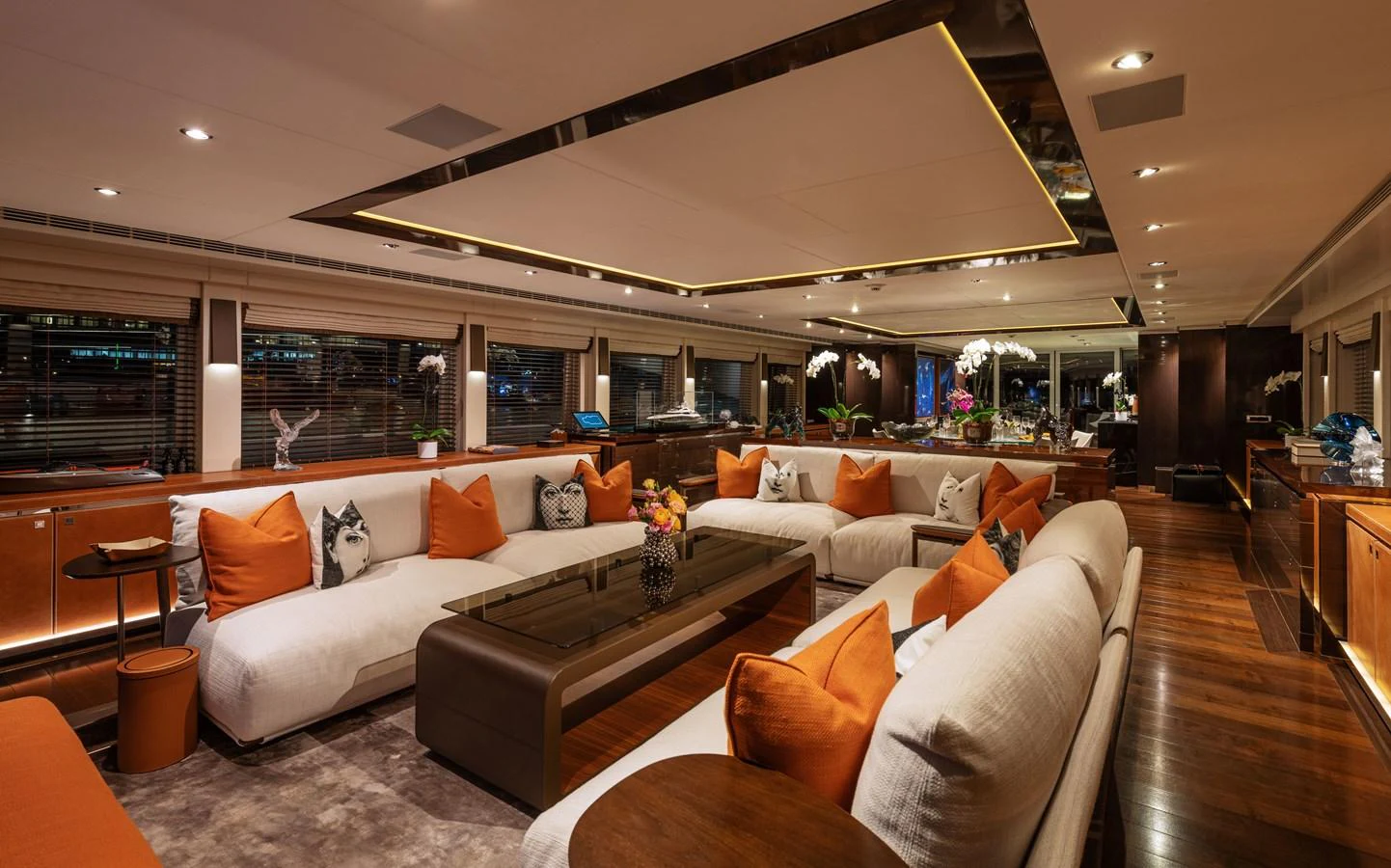 The yacht's salon exudes luxury with plush seating, warm lighting, and elegant decor. aboard ROCKET Yacht for Sale