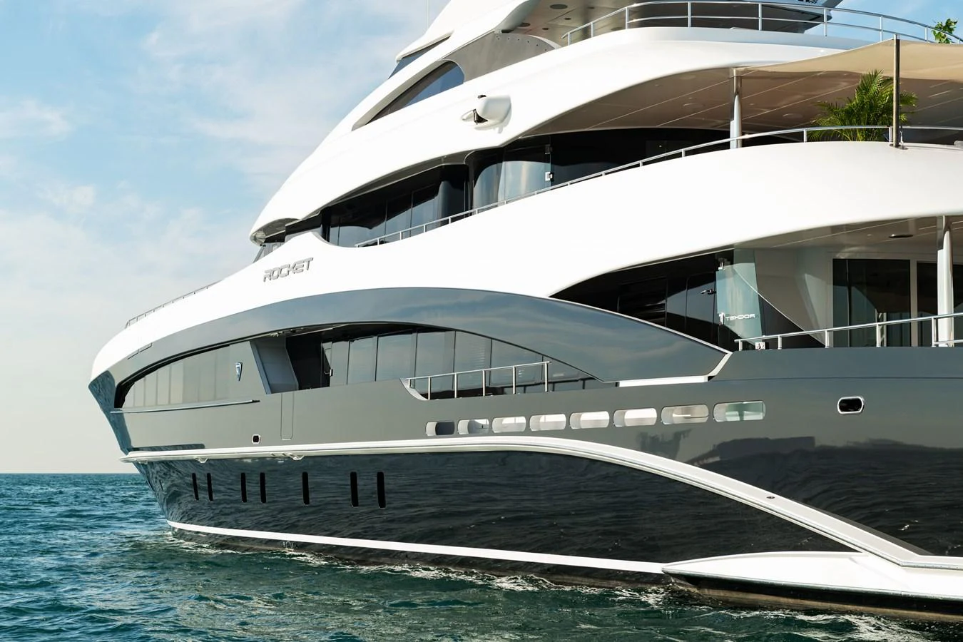 A sleek and modern yacht glides gracefully on the water, showcasing its elegant design and luxurious features. aboard ROCKET Yacht for Sale
