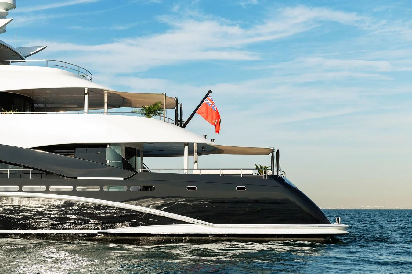 A sleek and modern yacht cruising on calm waters under a clear sky. aboard ROCKET Yacht for Sale