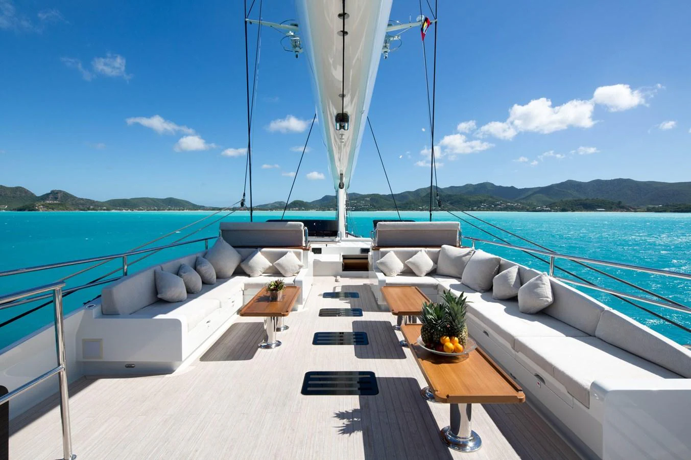The aft deck offers a spacious and inviting area with comfortable seating and stunning views of the turquoise waters. aboard OHANA Yacht for Sale
