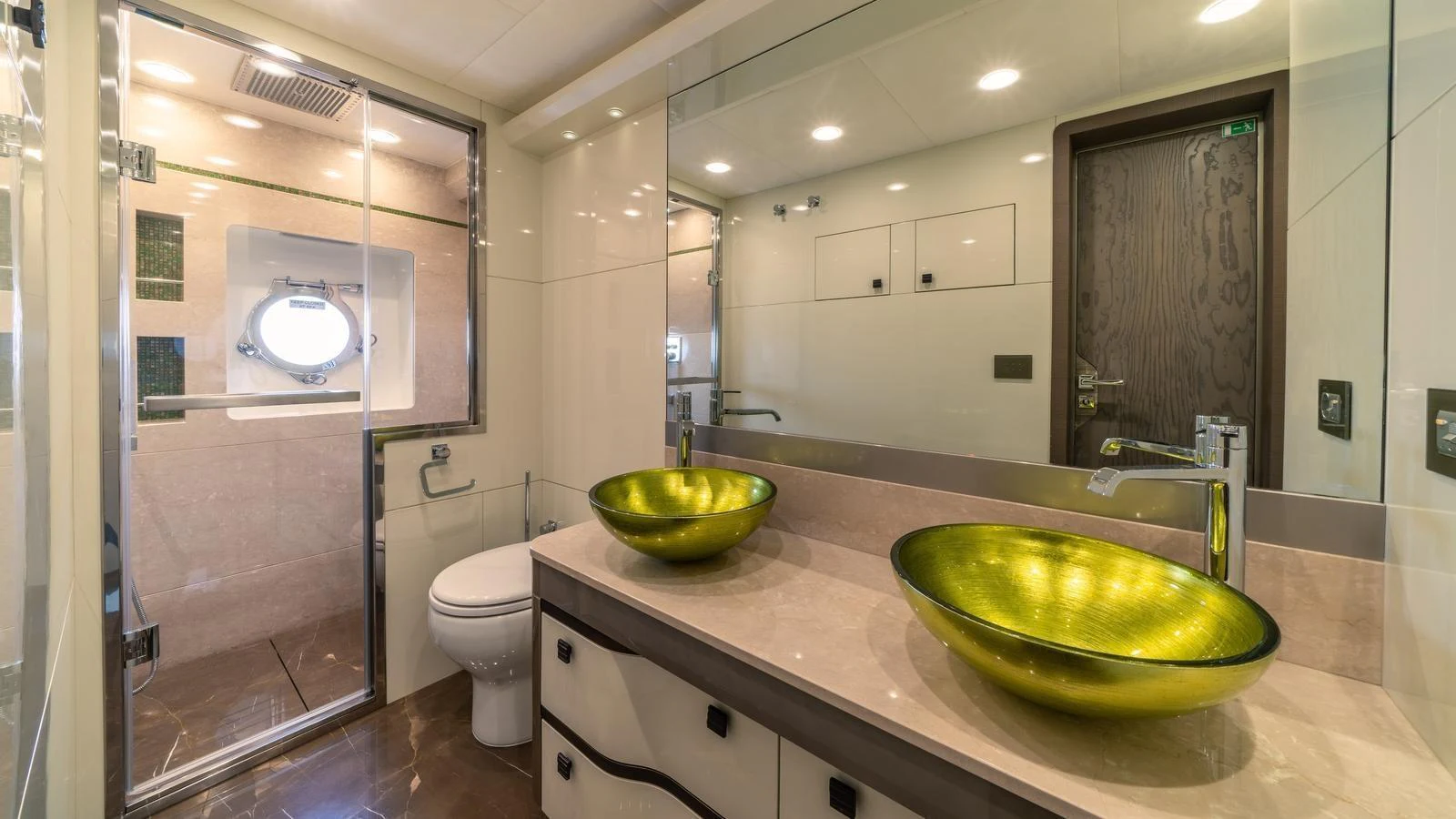 The yacht's bathroom features modern fixtures and a spacious shower area. aboard VIVALDI Yacht for Sale
