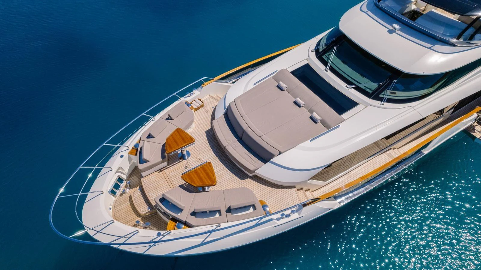 The foredeck of this yacht features luxurious sun pads and seating areas, perfect for relaxation. aboard VIVALDI Yacht for Sale