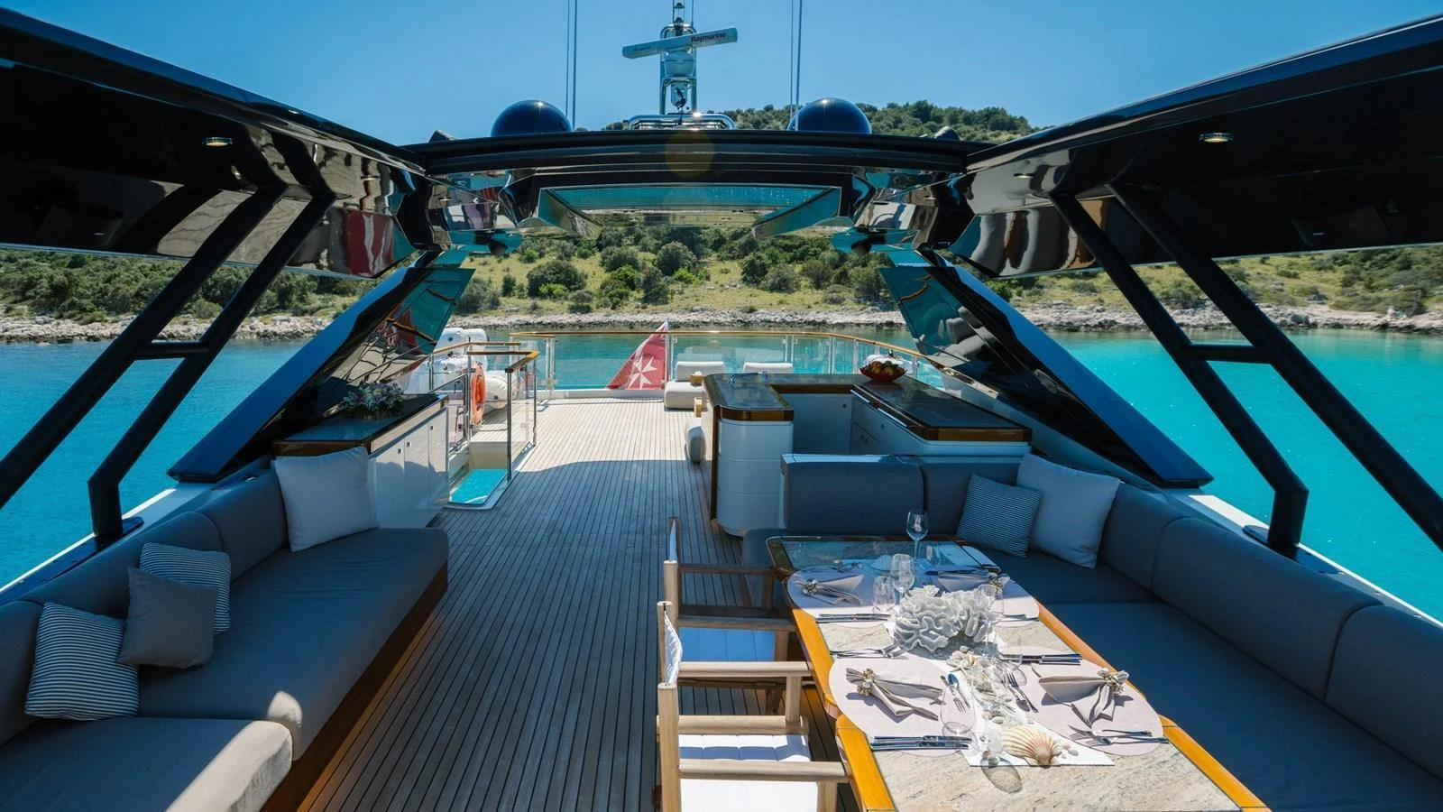 The aft deck offers a luxurious outdoor dining and lounging area with stunning views of the surrounding waters. aboard VIVALDI Yacht for Sale