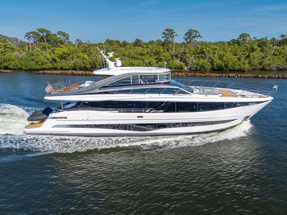 A sleek and modern yacht cruises along a serene waterway, showcasing its elegant design and spacious decks. aboard JUST PERFECT Yacht for Sale