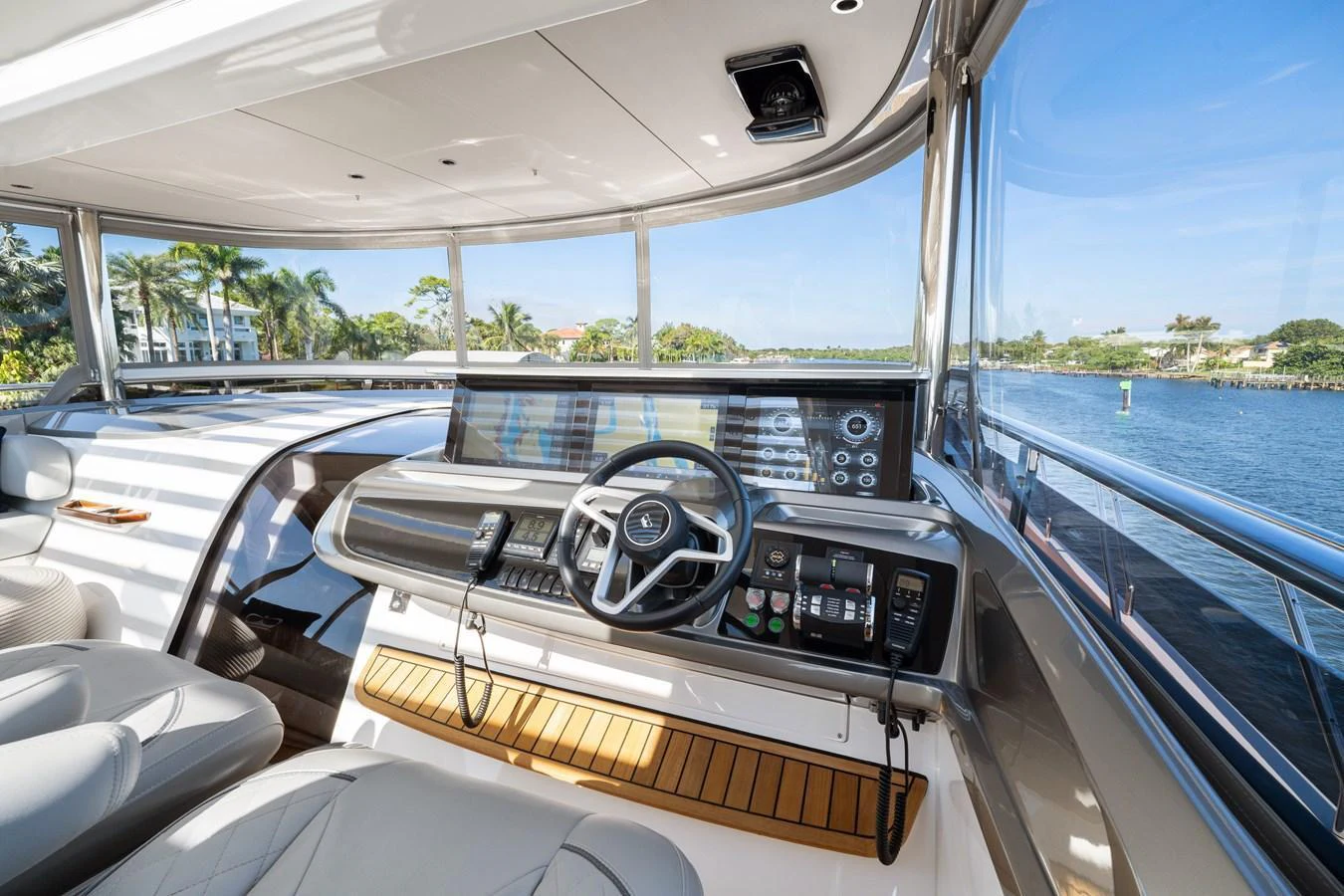 The helm station offers a panoramic view with state-of-the-art navigation equipment and luxurious seating. aboard JUST PERFECT Yacht for Sale