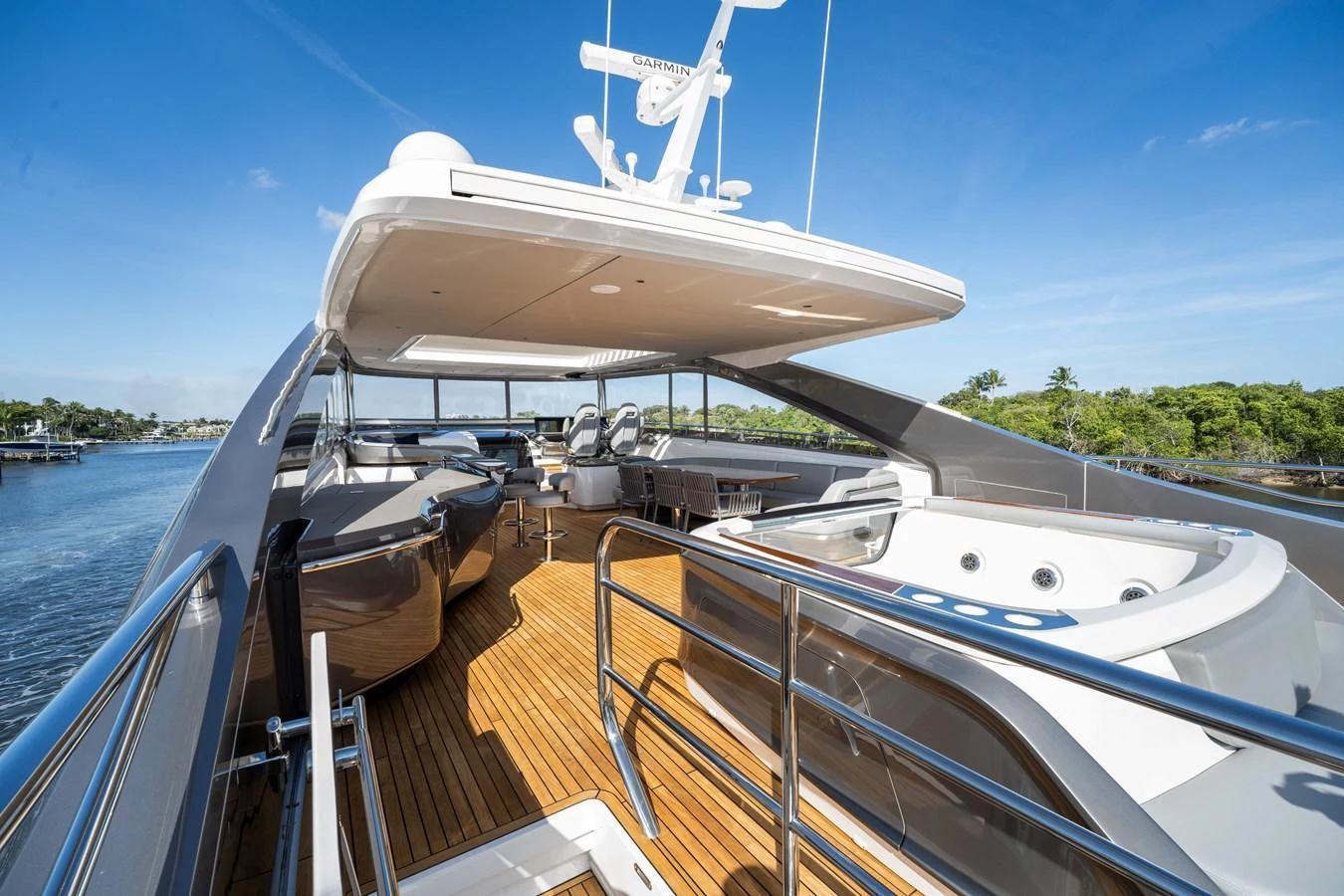 The flybridge offers a spacious area with a hot tub and ample seating, perfect for relaxation and entertainment. aboard JUST PERFECT Yacht for Sale