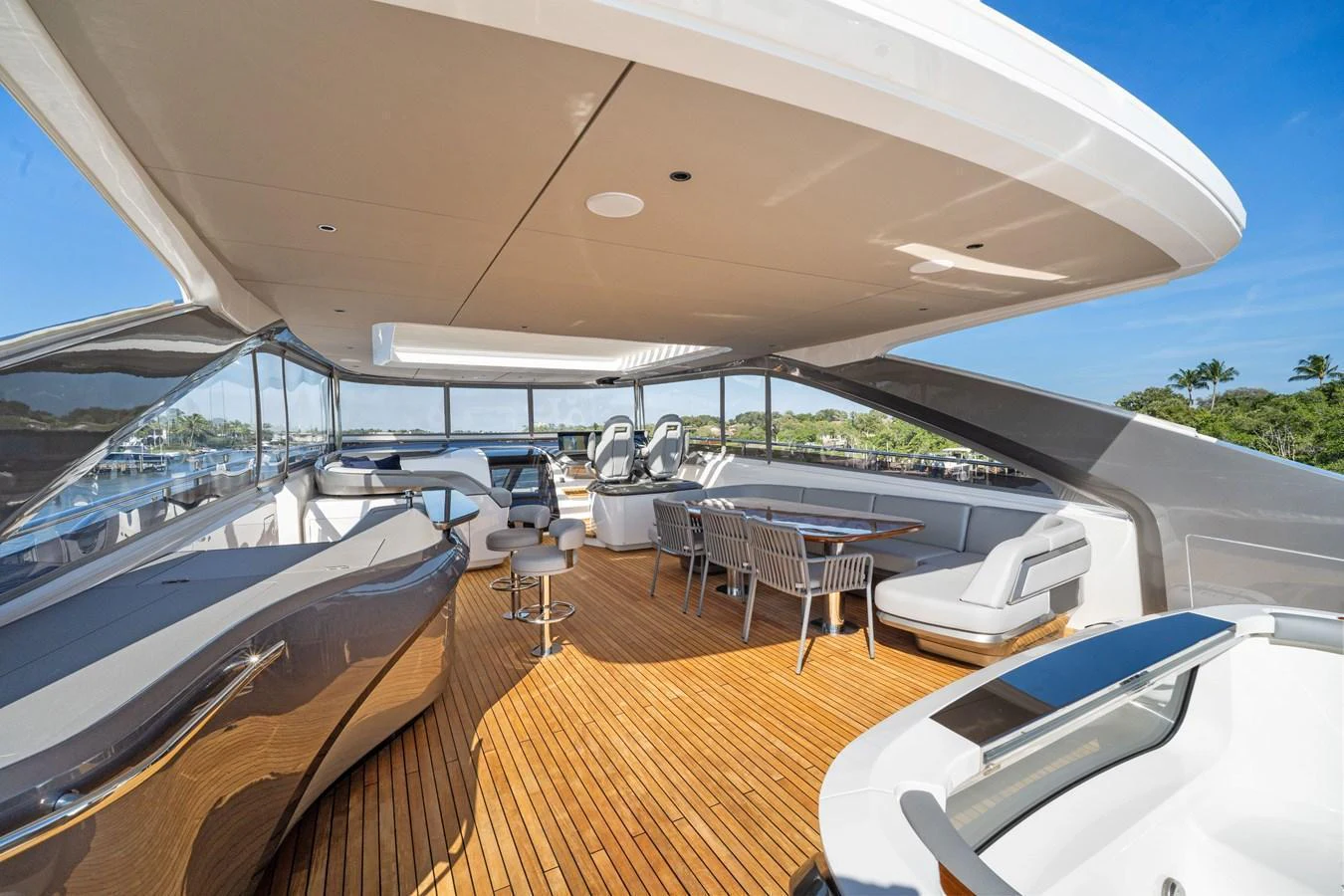 The flybridge offers a spacious and luxurious outdoor area with ample seating and stunning views. aboard JUST PERFECT Yacht for Sale