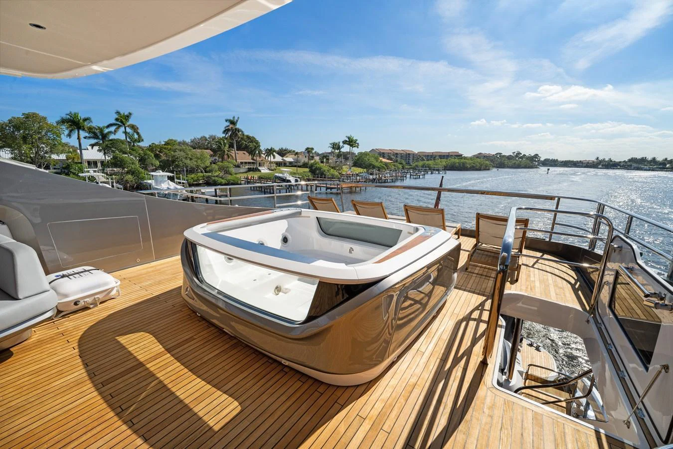 The yacht's sundeck features a luxurious hot tub with a stunning view of the water. aboard JUST PERFECT Yacht for Sale