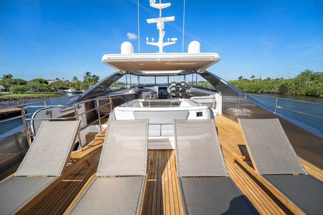 The sundeck offers ample lounging space with multiple sunbeds and a shaded seating area. aboard JUST PERFECT Yacht for Sale