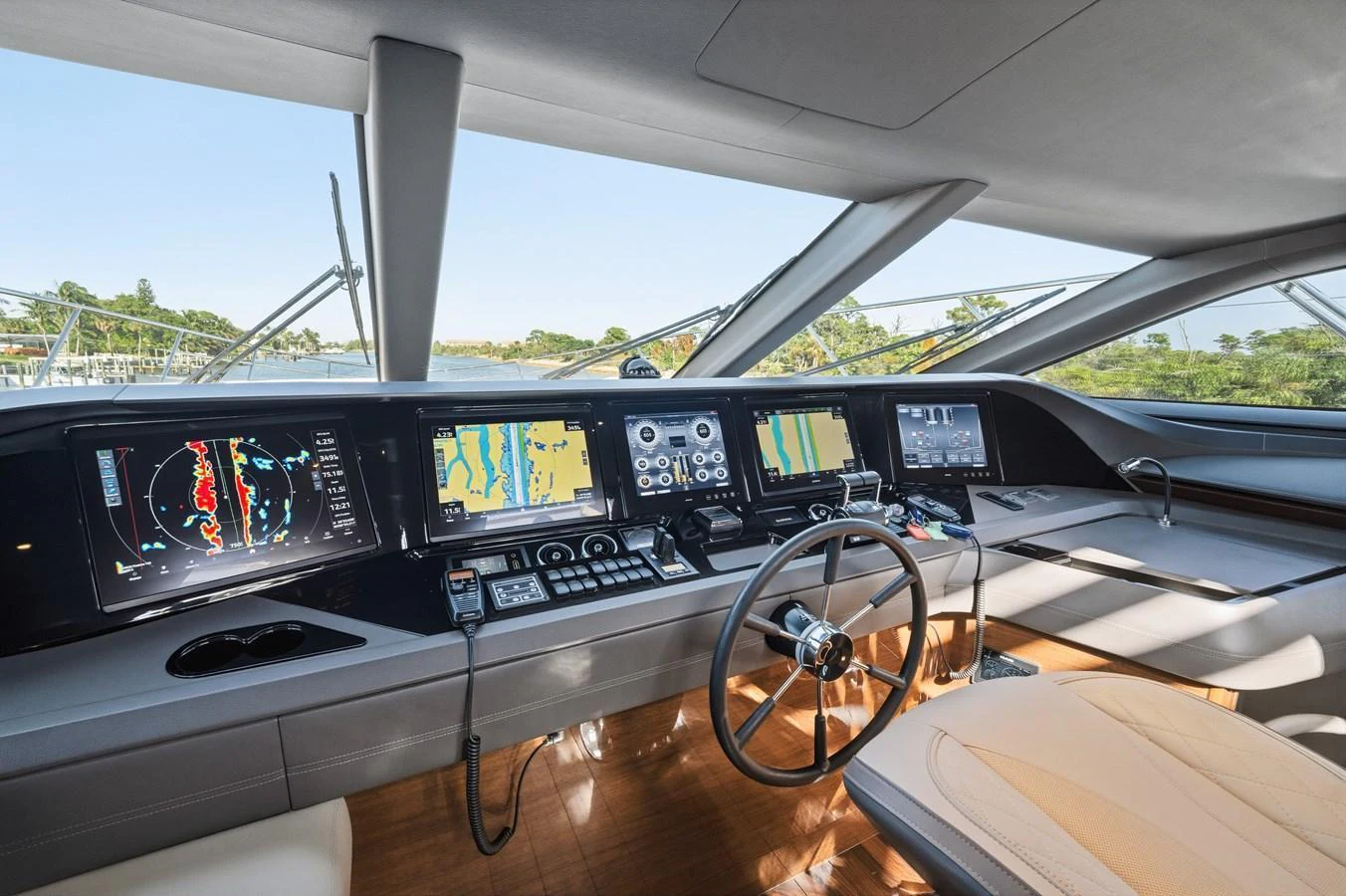 The helm station features advanced navigation equipment and luxurious seating, offering a commanding view for the captain. aboard JUST PERFECT Yacht for Sale