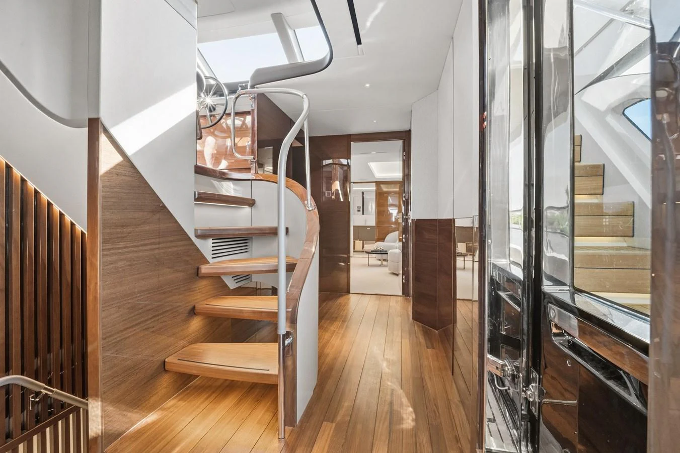 A beautifully designed interior staircase with wooden steps and modern railings. aboard JUST PERFECT Yacht for Sale