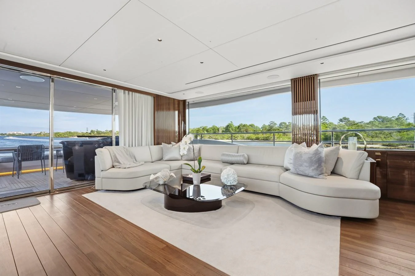 The salon offers a spacious and elegant seating area with panoramic views. aboard JUST PERFECT Yacht for Sale