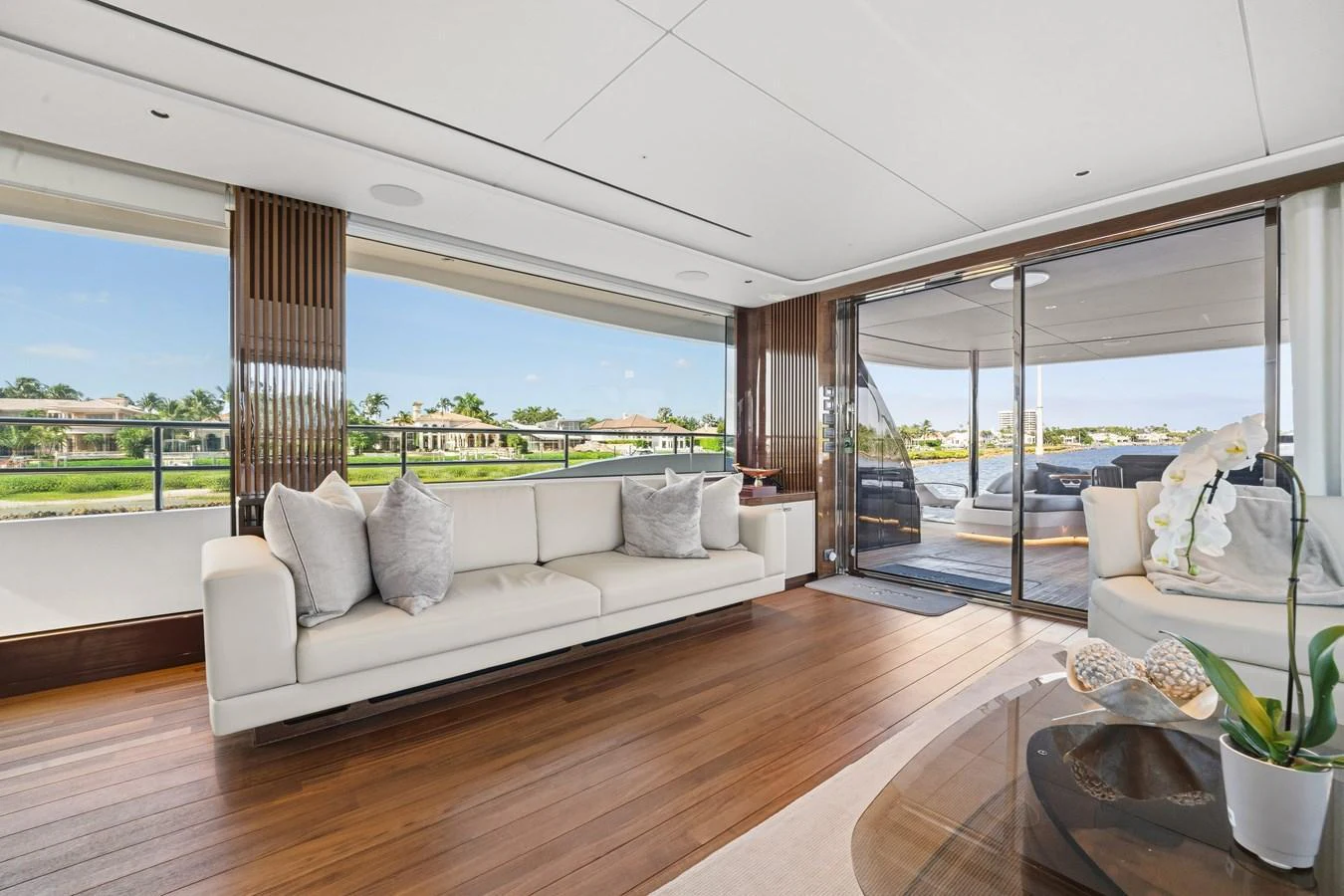The salon offers a spacious and elegant area with plush seating and panoramic views. aboard JUST PERFECT Yacht for Sale