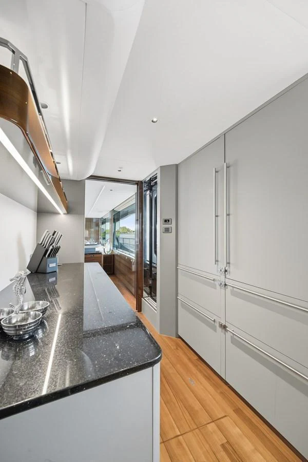 The sleek galley features modern appliances and ample counter space, perfect for gourmet meal preparation. aboard JUST PERFECT Yacht for Sale