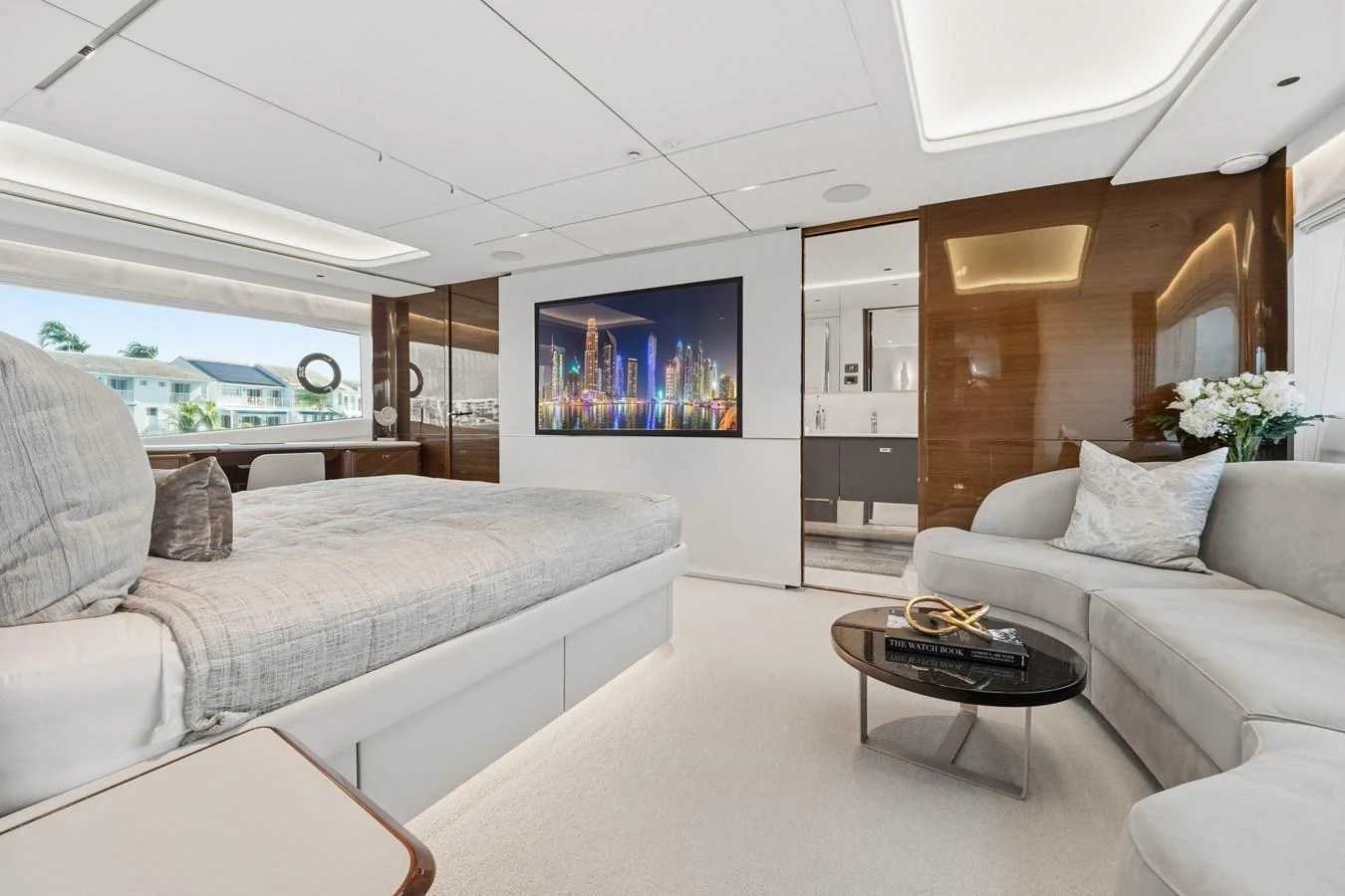 The master stateroom features a luxurious bed, a comfortable seating area, and modern decor. aboard JUST PERFECT Yacht for Sale