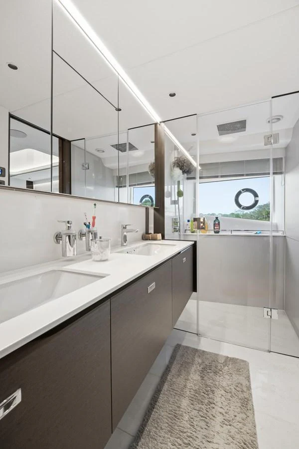 The yacht's bathroom features modern fixtures and a sleek design with ample natural light. aboard JUST PERFECT Yacht for Sale