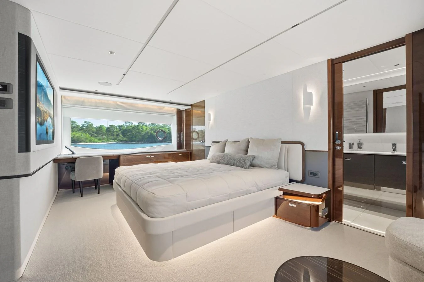 The master stateroom offers a luxurious and serene retreat with a large bed, ample natural light, and elegant furnishings. aboard JUST PERFECT Yacht for Sale