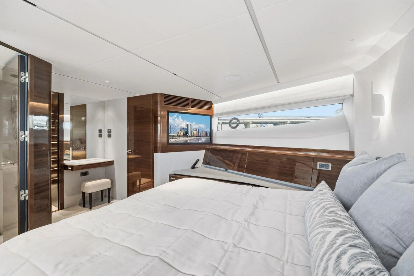 The master stateroom offers luxurious comfort with a large bed, modern decor, and ample natural light. aboard JUST PERFECT Yacht for Sale
