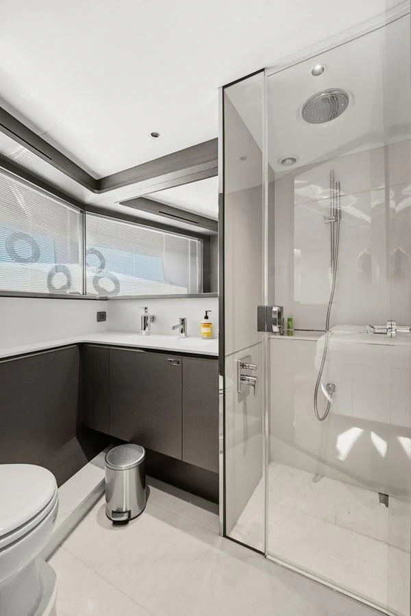 The yacht's bathroom features modern fixtures and a sleek design with ample natural light. aboard JUST PERFECT Yacht for Sale