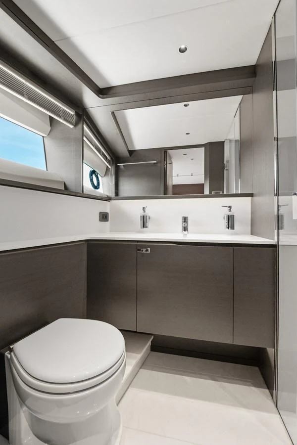 The yacht's bathroom features modern fixtures and a sleek design with ample natural light. aboard JUST PERFECT Yacht for Sale