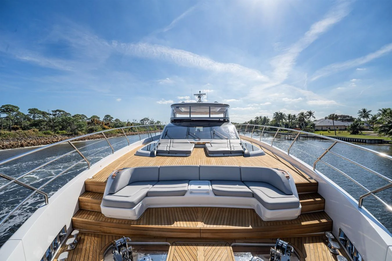 The yacht's foredeck features luxurious sun pads and seating, perfect for relaxation while cruising. aboard JUST PERFECT Yacht for Sale