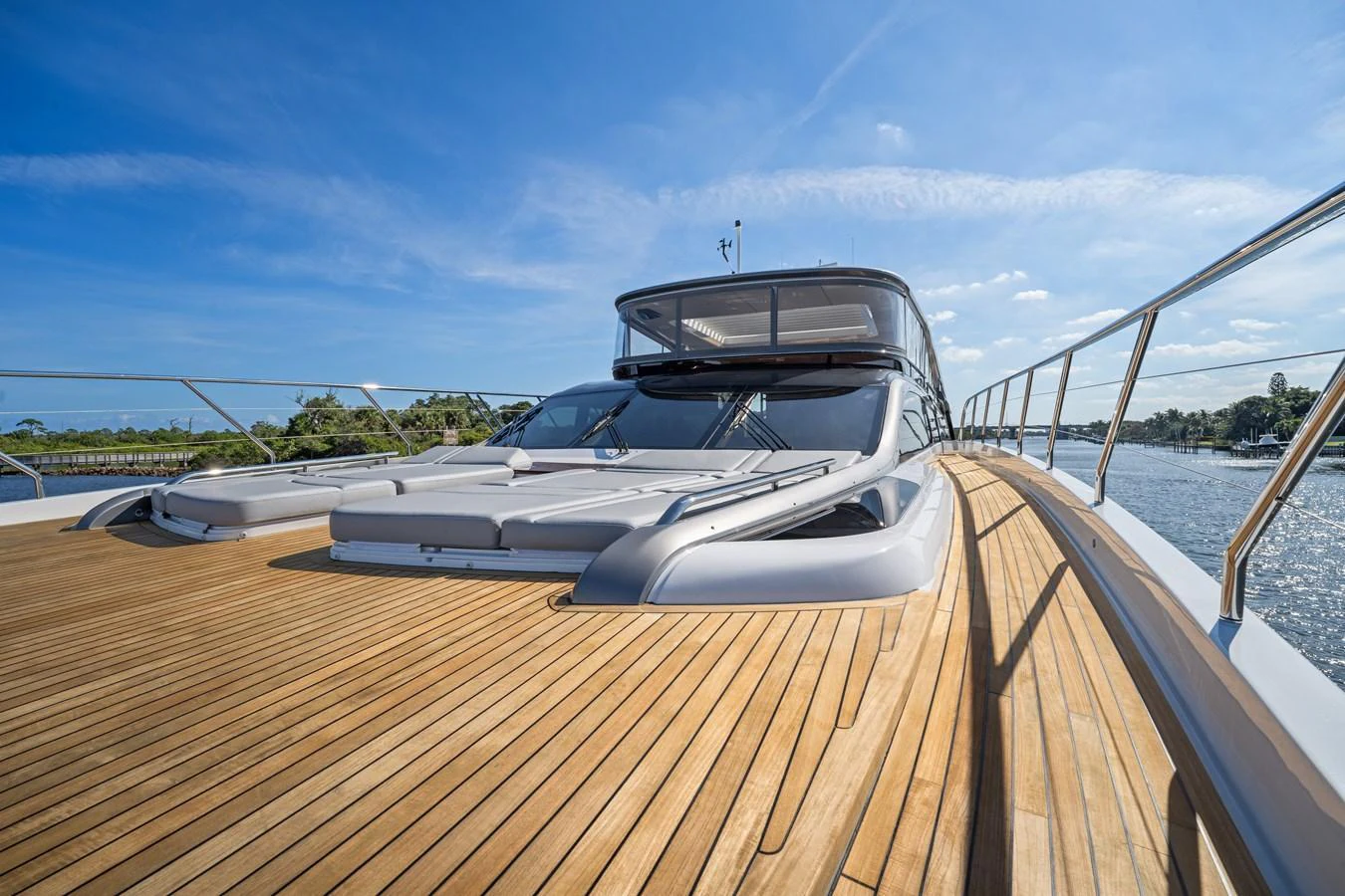 The yacht's expansive foredeck features luxurious sun pads and sleek design elements, perfect for relaxation and sunbathing. aboard JUST PERFECT Yacht for Sale