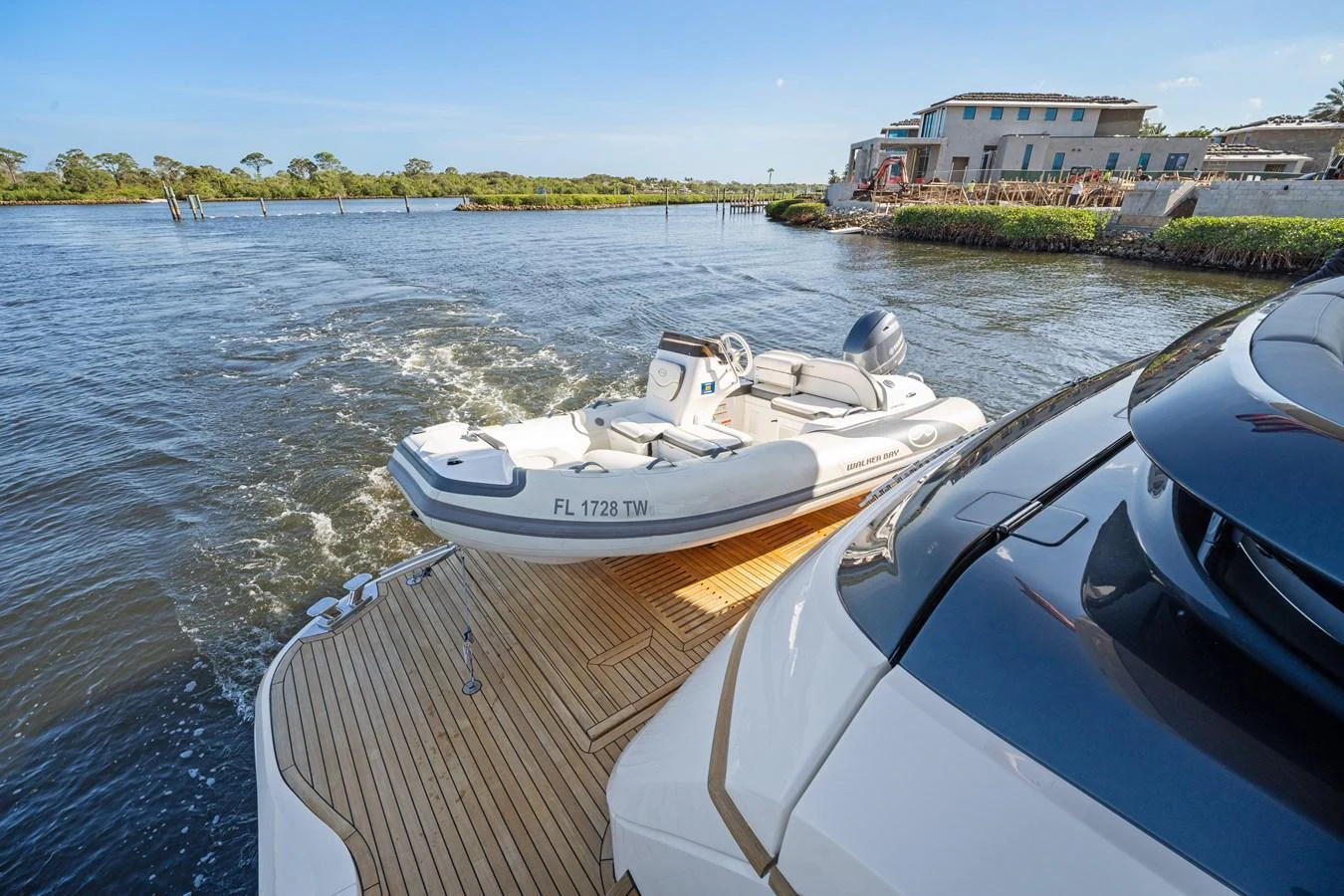 A sleek tender is secured on the aft deck of a yacht, ready for exploration. aboard JUST PERFECT Yacht for Sale