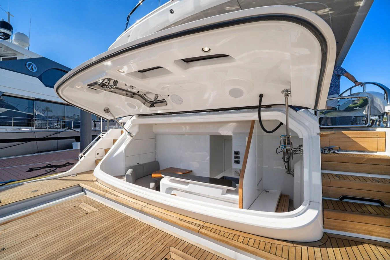 The yacht features a luxurious beach club area with comfortable seating and easy access to the water. aboard JUST PERFECT Yacht for Sale