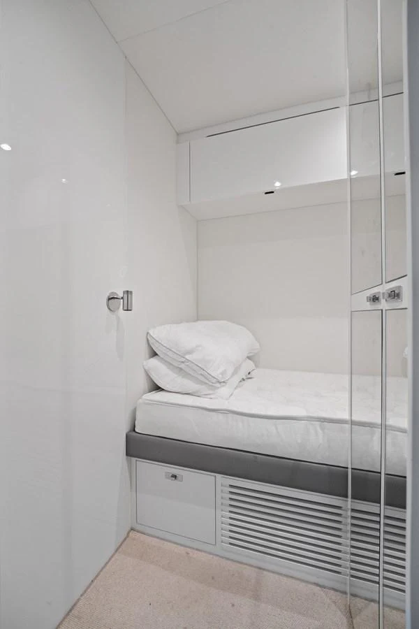 A cozy single cabin with a modern, minimalist design. aboard JUST PERFECT Yacht for Sale