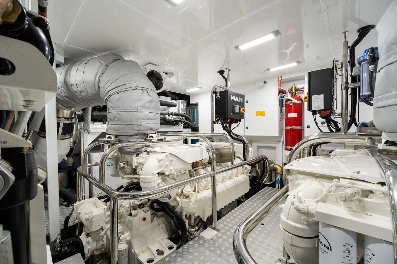 The engine room showcases powerful machinery and a clean, organized layout. aboard JUST PERFECT Yacht for Sale