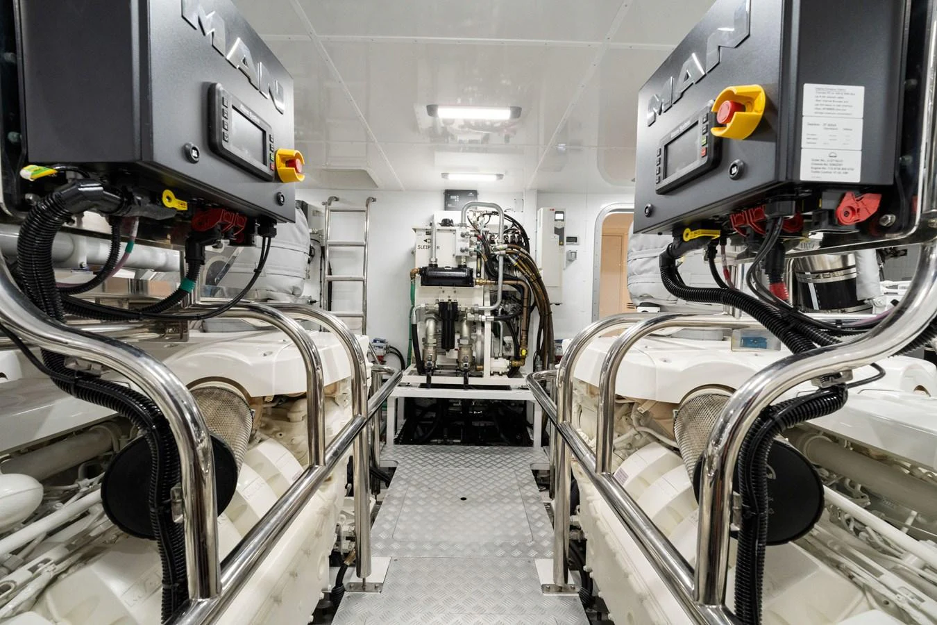 The engine room showcases powerful machinery and a clean, organized layout. aboard JUST PERFECT Yacht for Sale