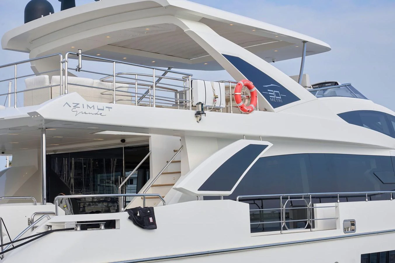 The yacht's aft deck features sleek lines and modern design elements. aboard SUN & SEA Yacht for Sale