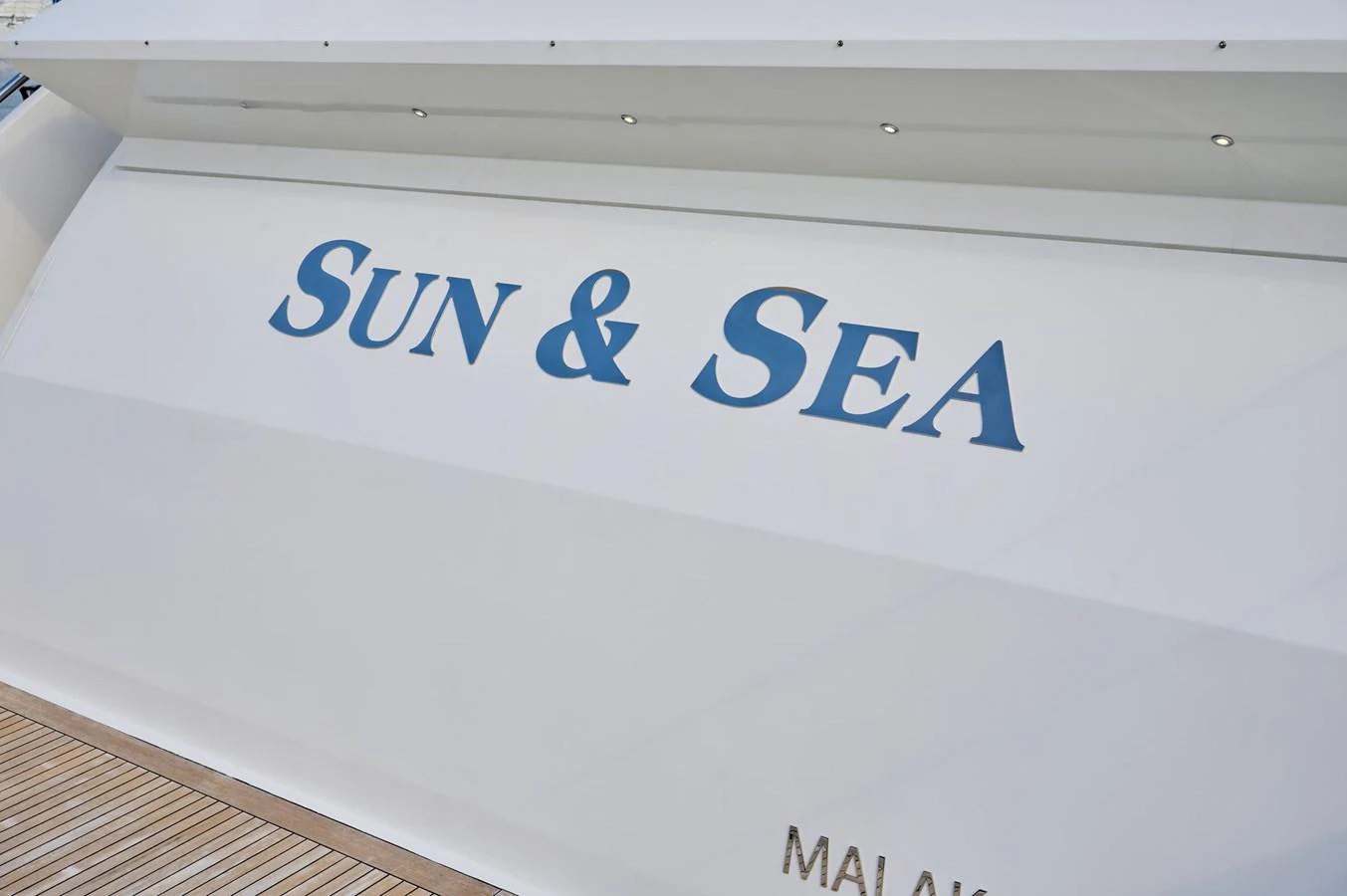 A close-up view of the yacht's name displayed on its exterior. aboard SUN & SEA Yacht for Sale