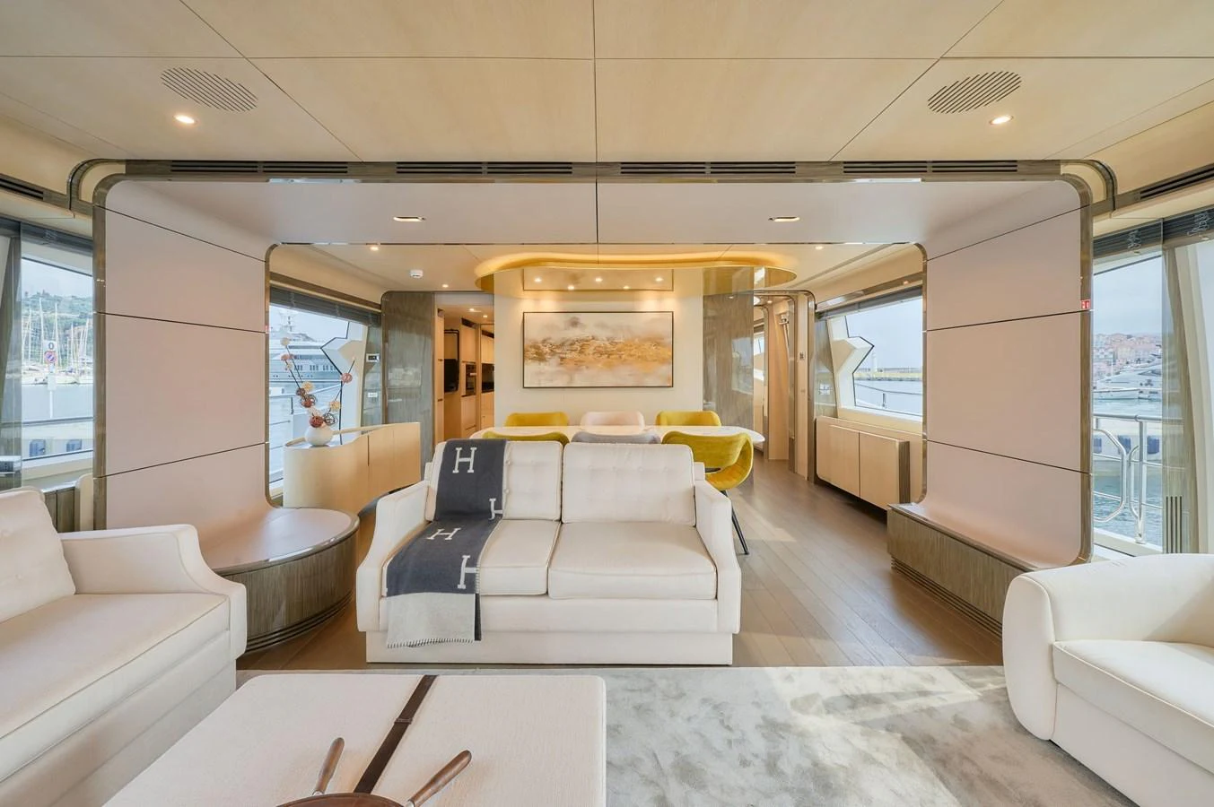 The yacht's salon features luxurious seating and elegant decor with ample natural light. aboard SUN & SEA Yacht for Sale