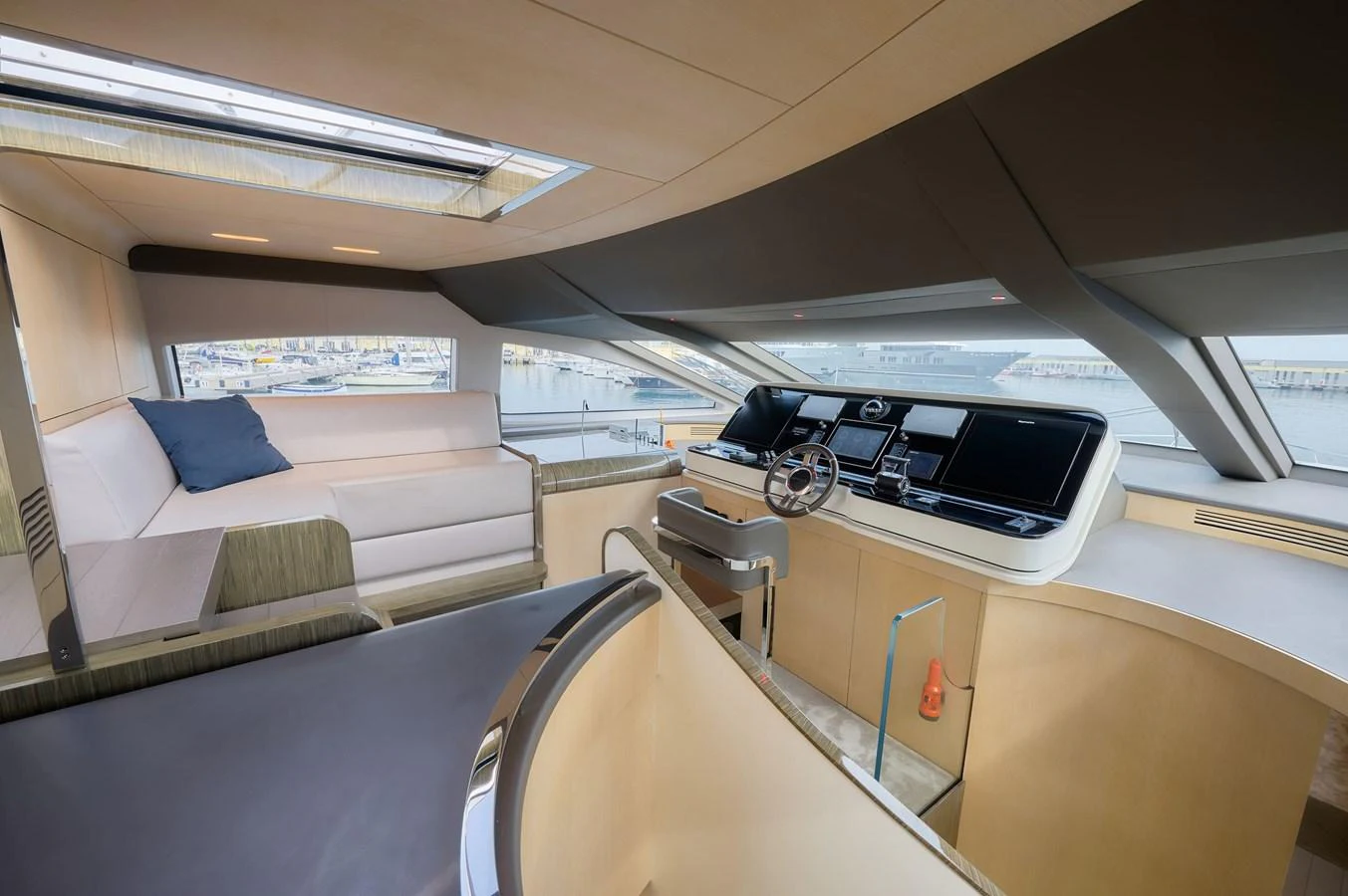 The helm area features a modern design with a spacious seating area and advanced navigation equipment. aboard SUN & SEA Yacht for Sale