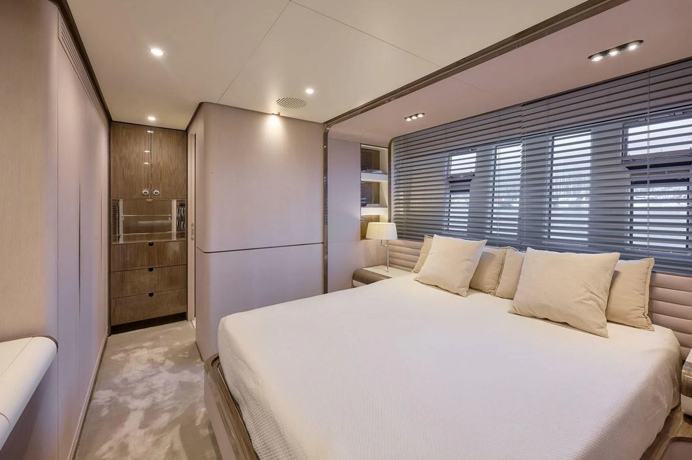 The master stateroom features a spacious bed, modern decor, and ample natural light. aboard SUN & SEA Yacht for Sale
