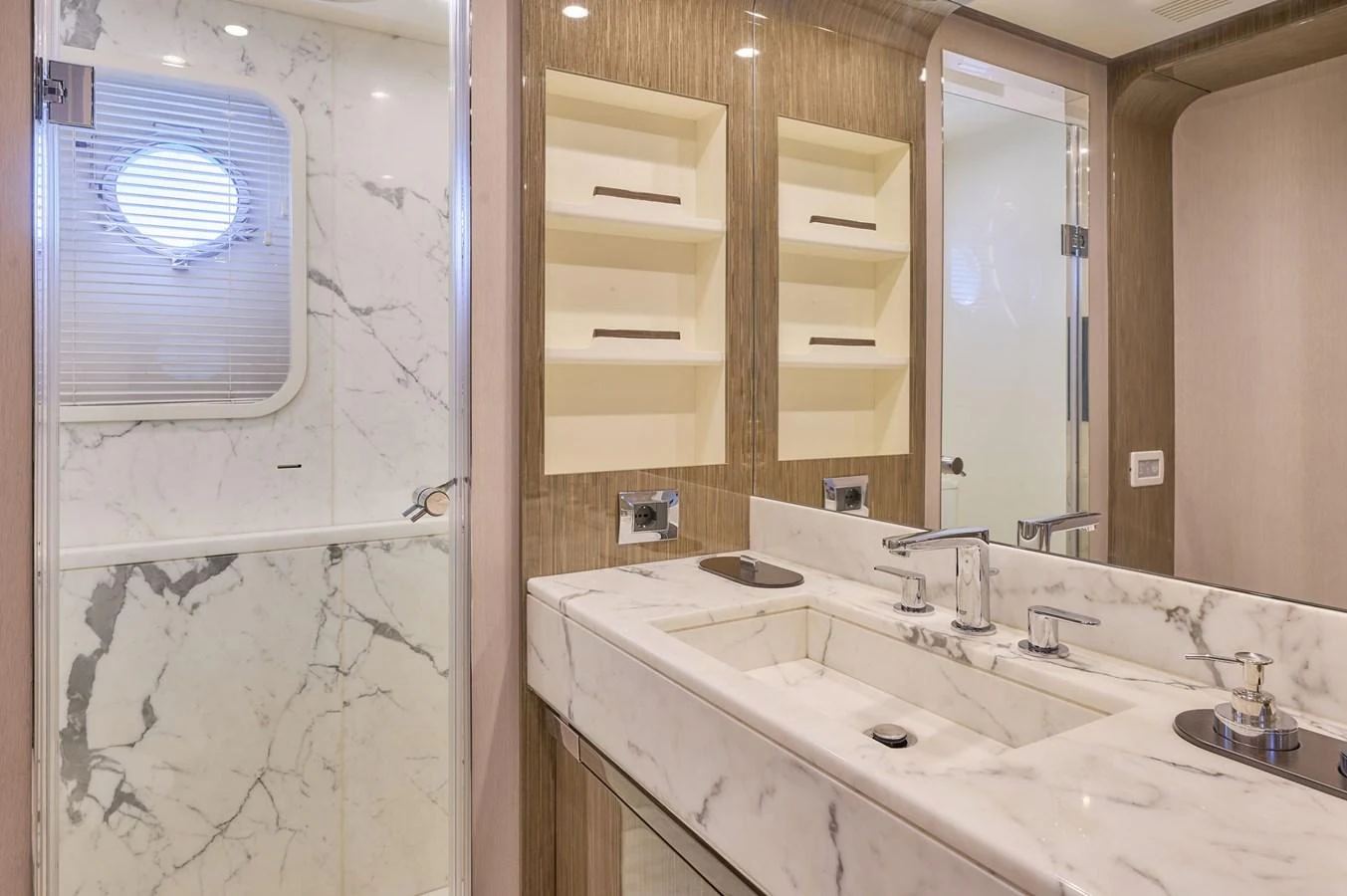 The yacht's bathroom features elegant marble surfaces and modern fixtures. aboard SUN & SEA Yacht for Sale