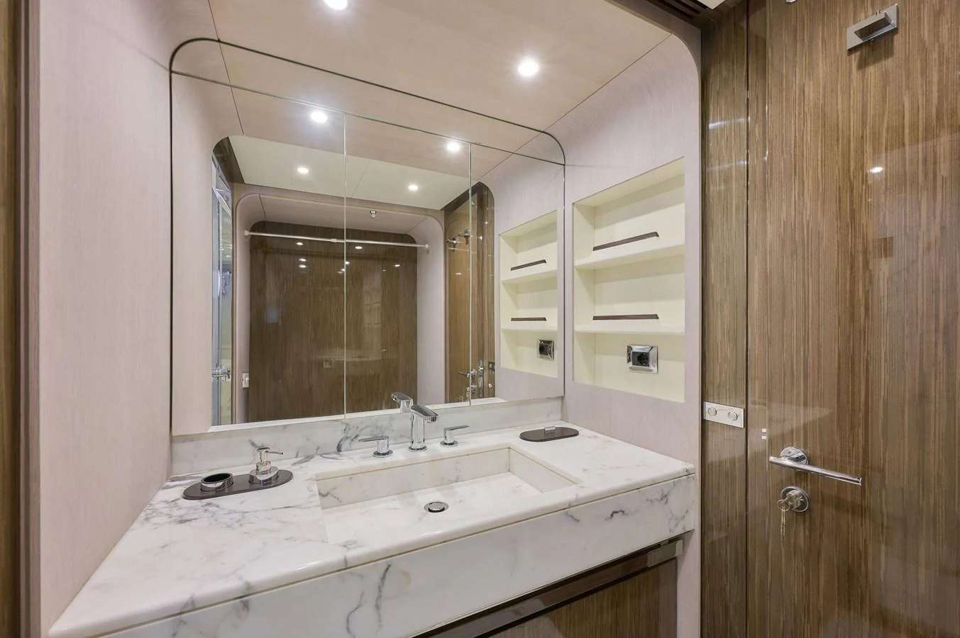The yacht's bathroom features a sleek marble countertop and modern fixtures. aboard SUN & SEA Yacht for Sale