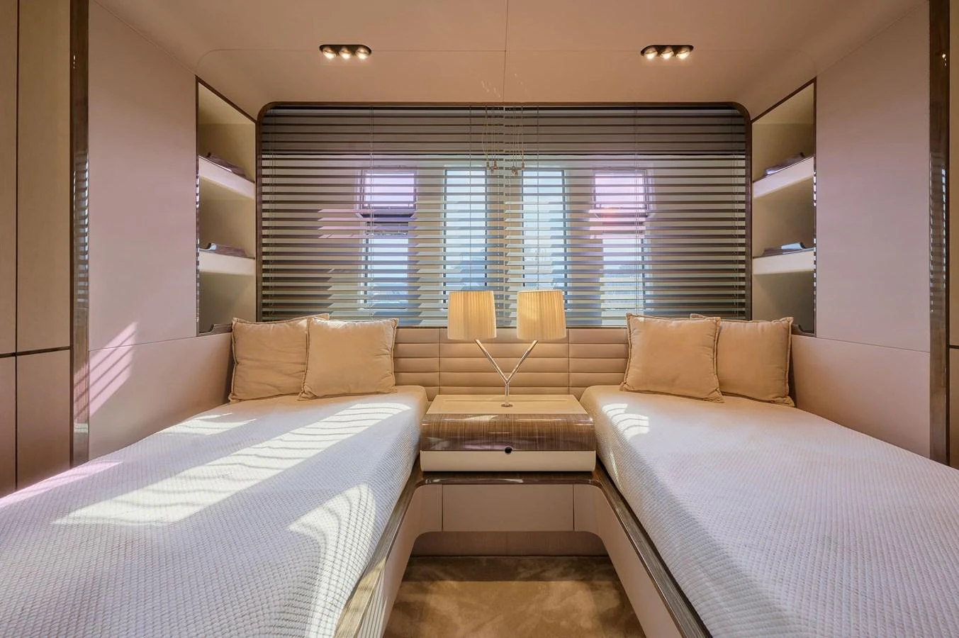 The guest stateroom features twin beds and a modern, elegant design. aboard SUN & SEA Yacht for Sale