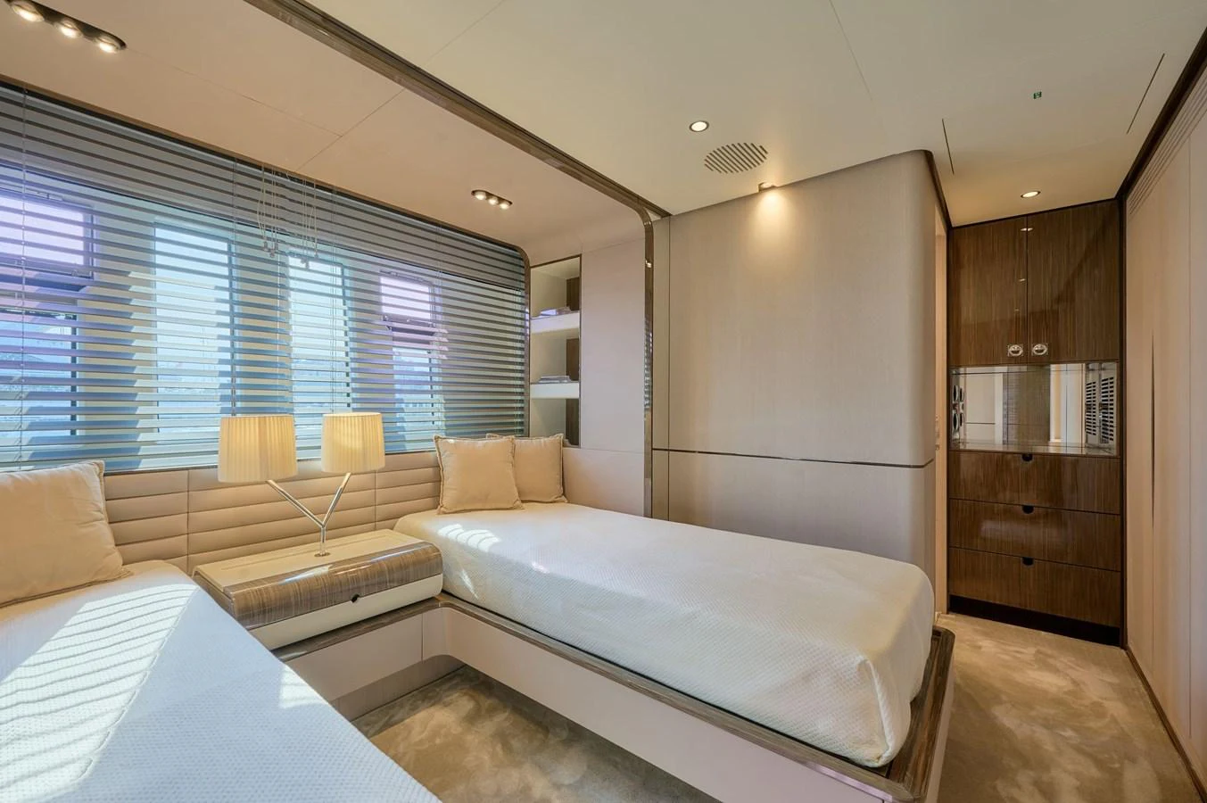 The guest stateroom features twin beds and elegant, modern decor. aboard SUN & SEA Yacht for Sale