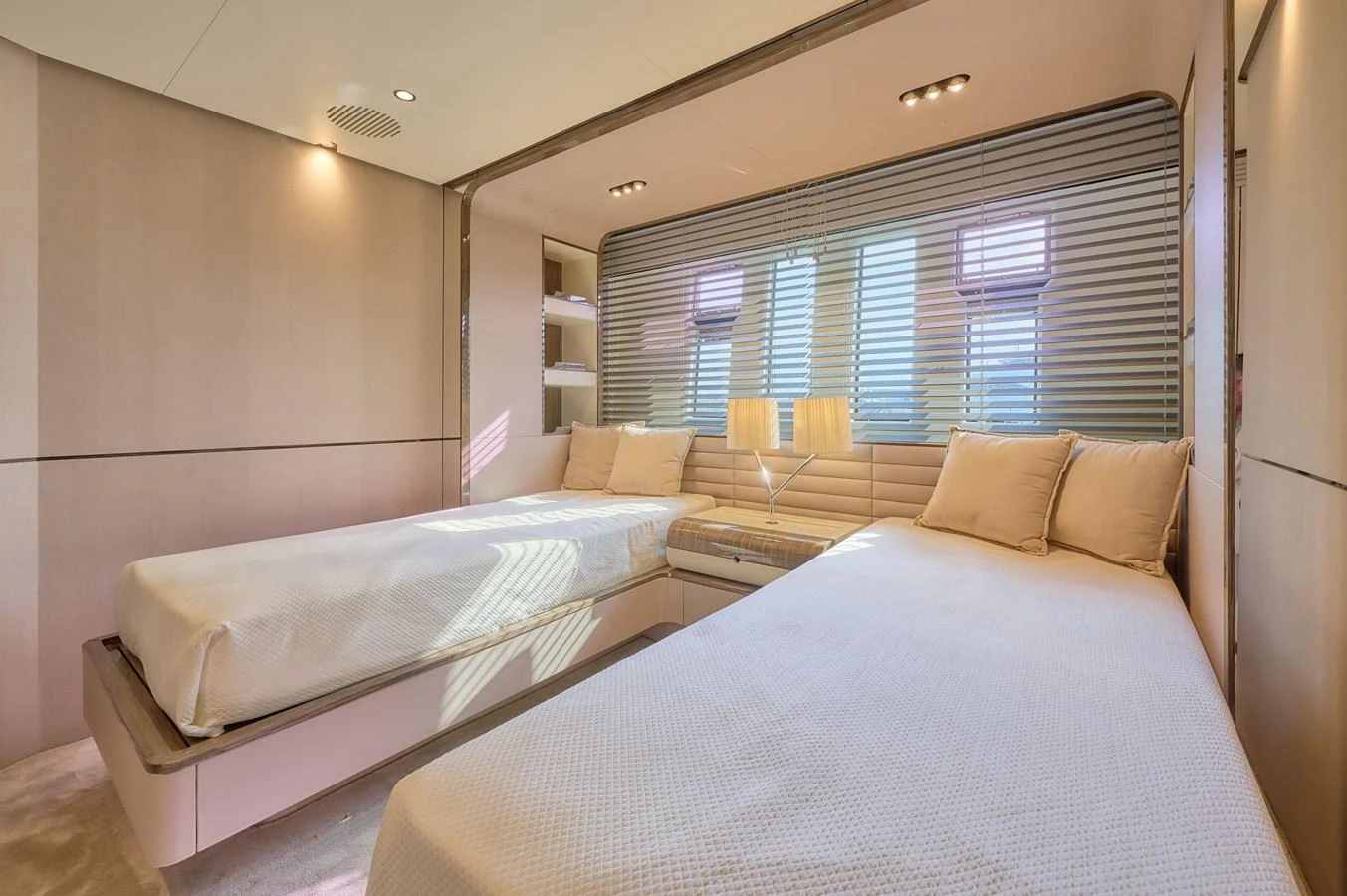 The guest stateroom features twin beds with modern decor and ample natural light. aboard SUN & SEA Yacht for Sale