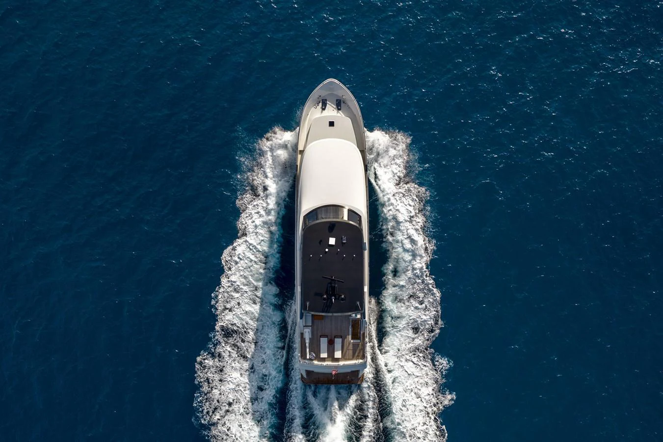 An aerial view of a sleek yacht cruising through the deep blue sea. aboard OCEAN ALEXANDER 28L Yacht for Sale