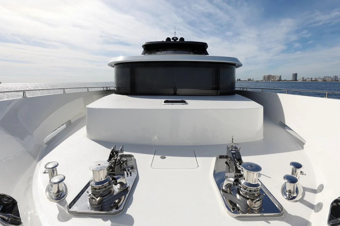The yacht's bow features a sleek design with polished metal fittings and a spacious deck area. aboard OCEAN ALEXANDER 28L Yacht for Sale