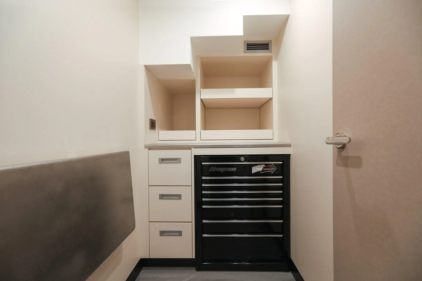 A compact and functional storage area with built-in shelves and drawers. aboard OCEAN ALEXANDER 28L Yacht for Sale
