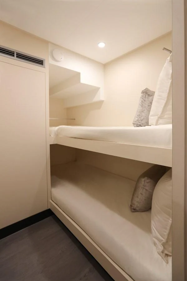 The crew cabin features practical bunk beds with a clean and minimalist design. aboard OCEAN ALEXANDER 28L Yacht for Sale