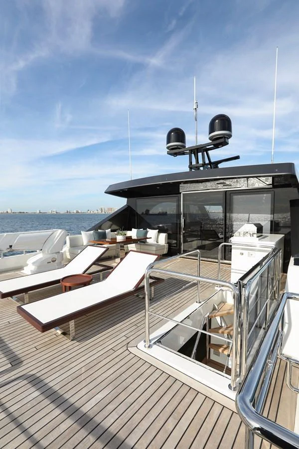The sundeck offers a spacious area for relaxation with sun loungers and a stunning view of the sea. aboard OCEAN ALEXANDER 28L Yacht for Sale