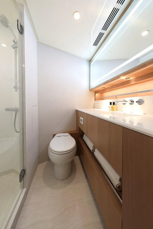 A modern yacht bathroom with sleek fixtures and ample storage. aboard OCEAN ALEXANDER 28L Yacht for Sale