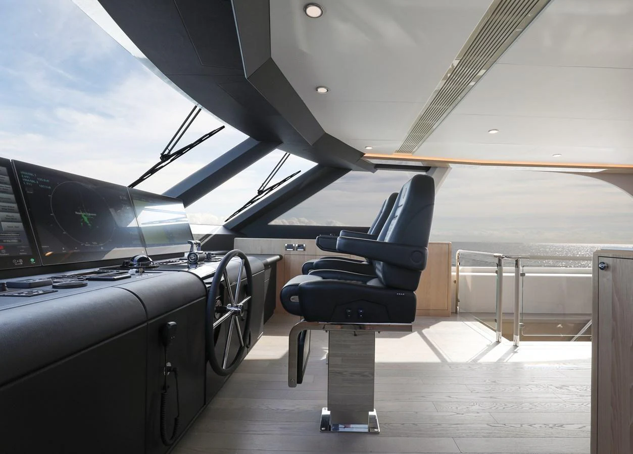 The helm station features modern controls and comfortable seating with panoramic views. aboard OCEAN ALEXANDER 28L Yacht for Sale